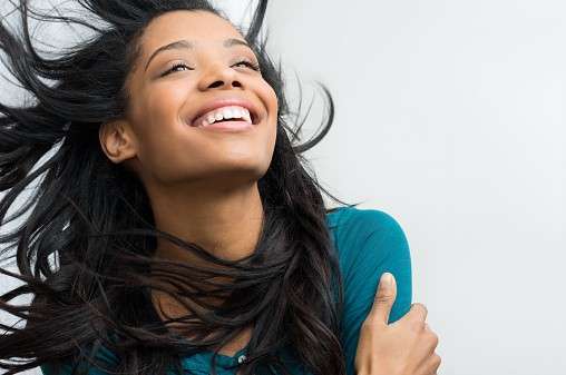 Smiling woman with Natural Straight Black Hair