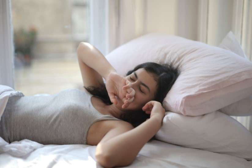 woman waking up in bed