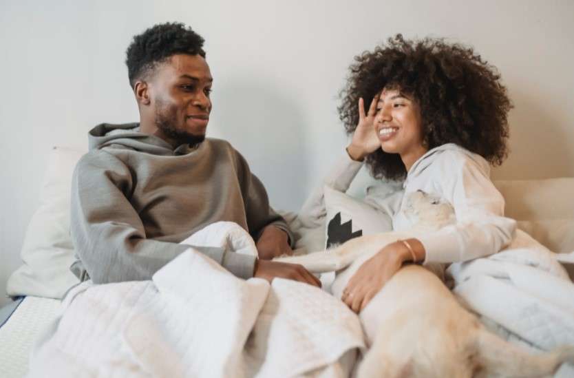couples talking in bed