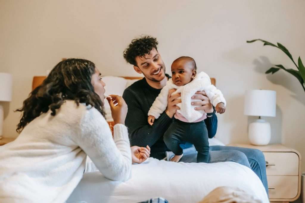 A baby girl with her parents