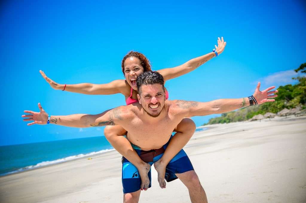 Smiling couple on the beach