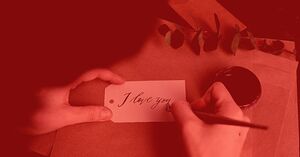 hands writing i love you note