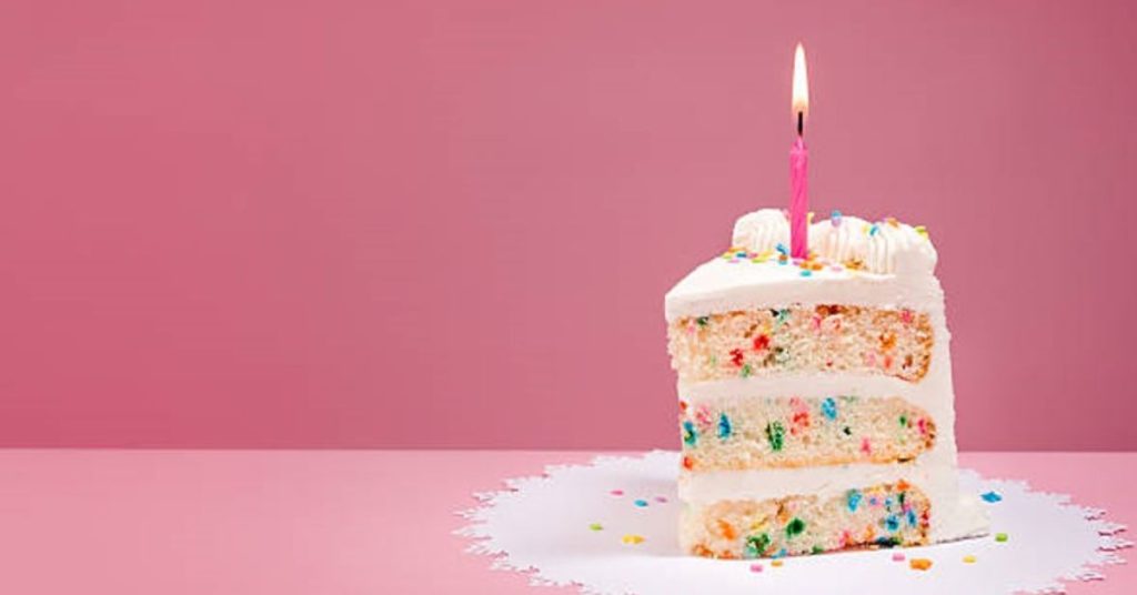 A Slice of Birthday Cake with a Candle